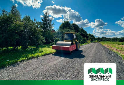 Укатка катком асфальтной крошки подъездной дороги к поселку «Есенино»
